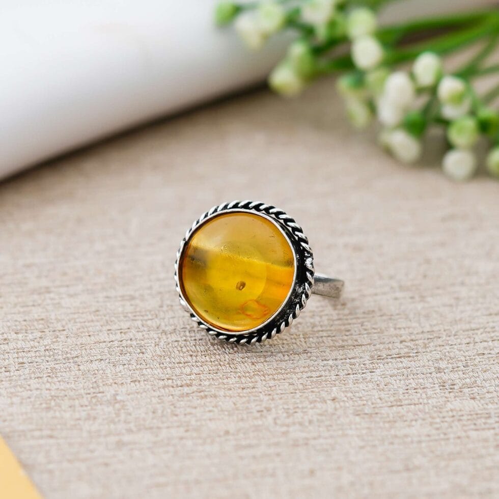 Round yellow amber gemstone ring with silver antique setting for women’s jewellery