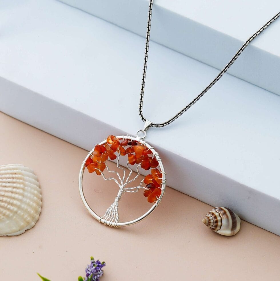 Carnelian crystal Tree of Life pendant necklace for energy, confidence, and positivity