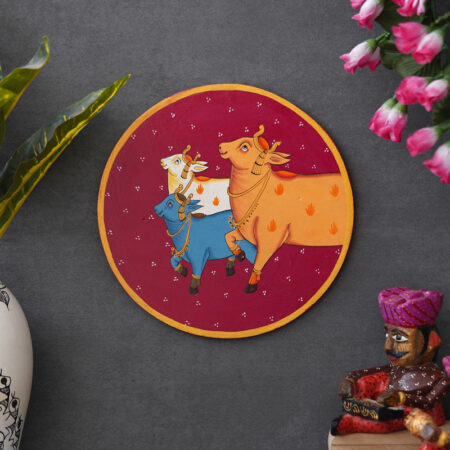 Traditional Pichwai art of three cows adorned with jewelry — perfect for adding a cultural touch to interiors.