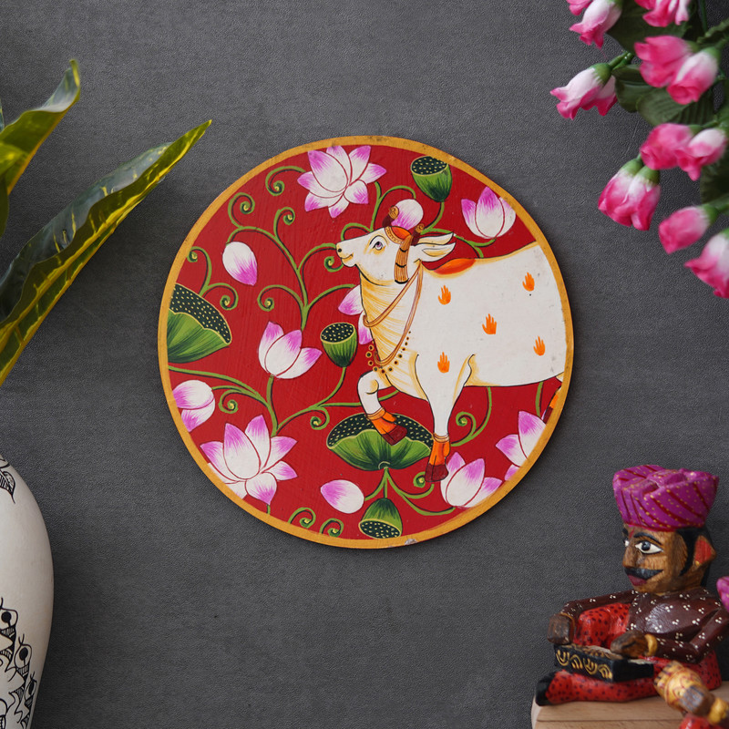 Artistic cow and lotus Pichwai painting — colorful Indian folk wall decor symbolizing purity and prosperity.