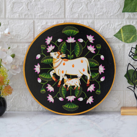 Traditional Indian Pichwai cow wall painting with lotus blooms – symbol of peace, purity, and devotion.