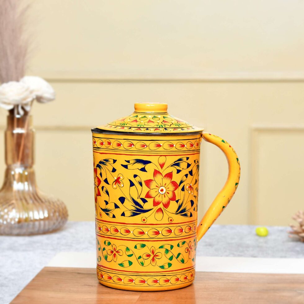 Handmade stainless steel jug with lid, decorated in vibrant Indian floral artwork