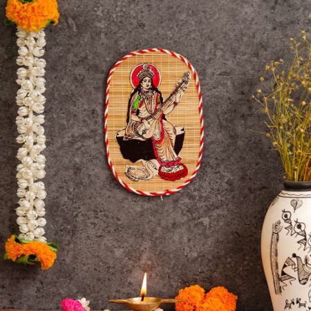Artisan-crafted bamboo wall decor depicting Saraswati Maa, cultural Indian art for Diwali festive interiors