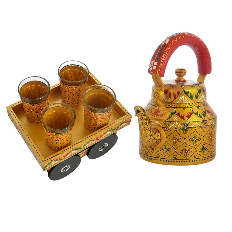 Vibrant yellow floral hand-painted tea kettle and wooden cart glass set, perfect for traditional Indian home decor