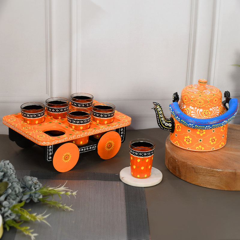 Colorful Indian art-inspired tea kettle and wooden cup holder set with traditional motifs