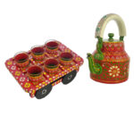 Vibrant red and green floral hand-painted tea kettle with wooden cart glass set, perfect for traditional Indian home decor