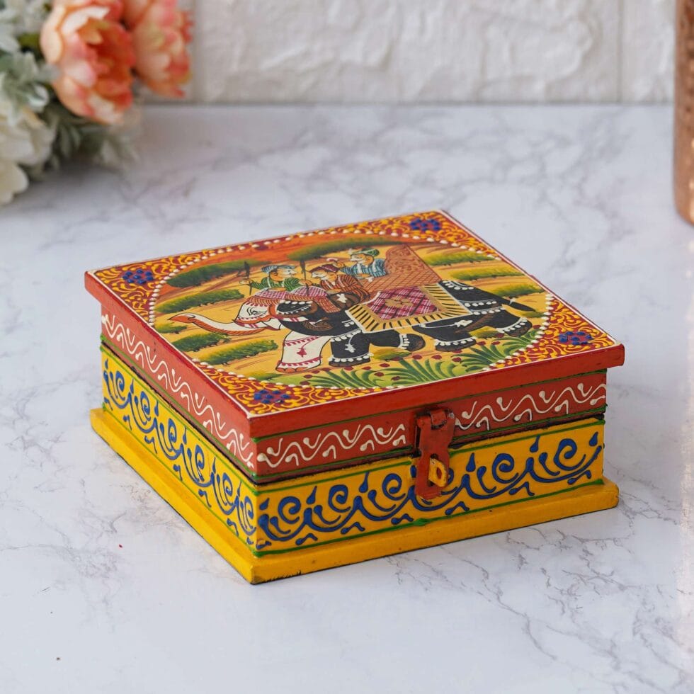 Traditional Indian wooden storage box with vibrant elephant motif, handcrafted decorative gift box for ethnic interiors.