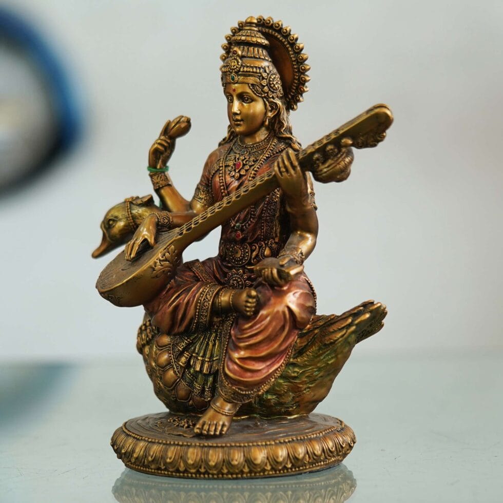 Antique brass Saraswati statue seated on swan, perfect spiritual gift for Diwali festival