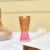 Decorative pink and gold aluminium glass with festive handcrafted detailing