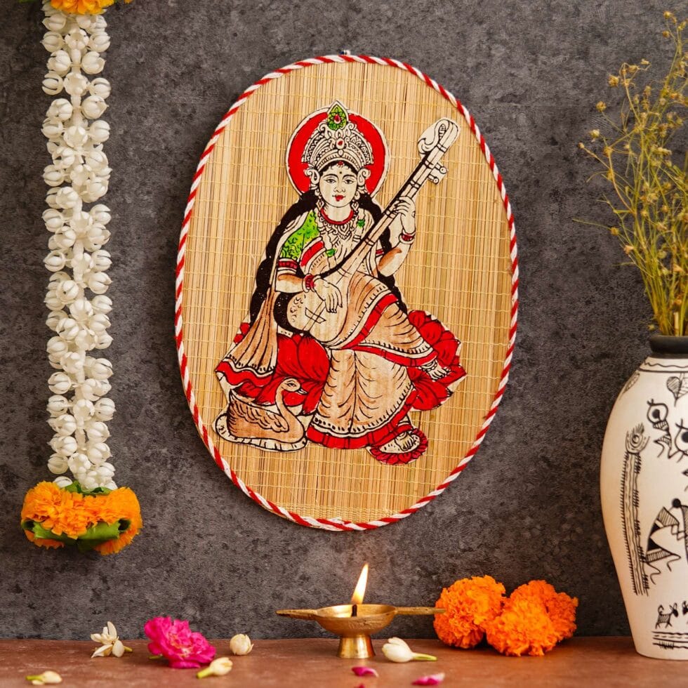 Artisan-crafted bamboo wall decor with Saraswati Devi painting, cultural Diwali festive interiors