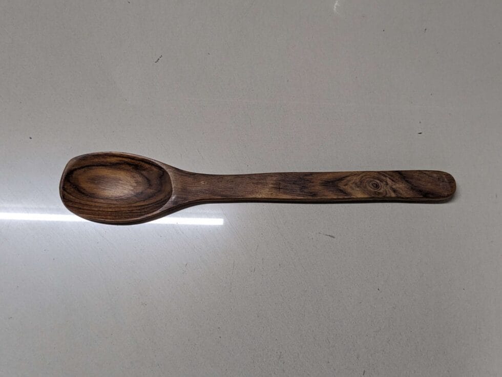 Natural wooden ladle and spatula combo – artisanal finish for elegant kitchenware.