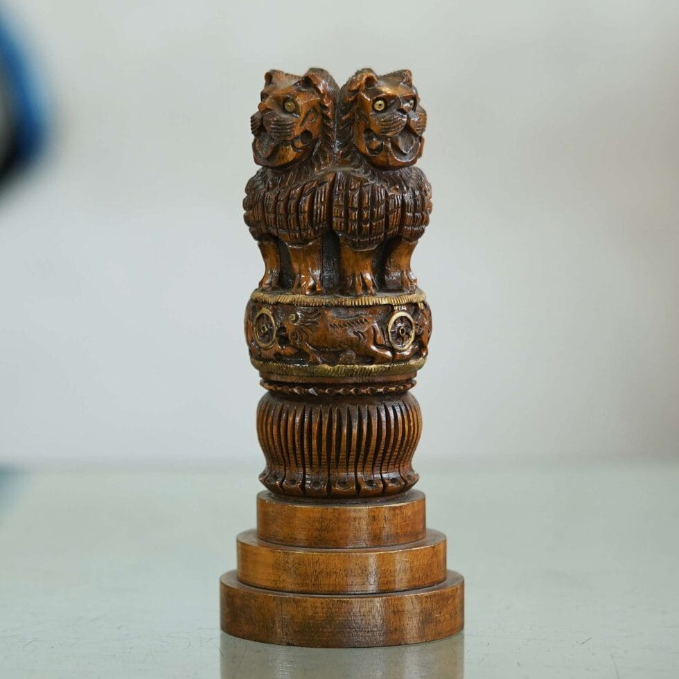 Handcrafted wooden Ashoka Pillar with detailed lion carving, Indian national emblem replica for decor.