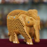 Traditional handmade wooden elephant statue perfect for home décor or gifting.