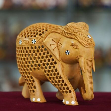 Traditional handmade wooden elephant statue perfect for home décor or gifting.