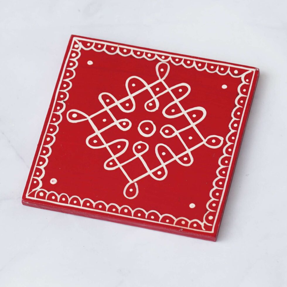 Ethnic red coasters with white mandala design, handcrafted wooden set for elegant home use