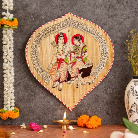 Artisan-crafted bamboo wall hanging depicting Ram and Sita, cultural Indian art for Diwali interiors