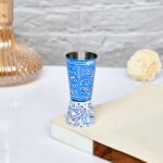 Artisan crafted blue and white aluminium tumbler with folk floral motifs, home decor accessory
