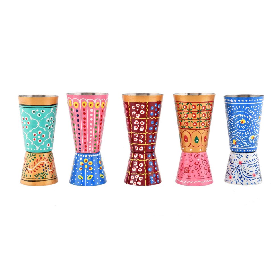 Ethnic Indian art-inspired stainless steel cups, ideal for kitchen and decor use