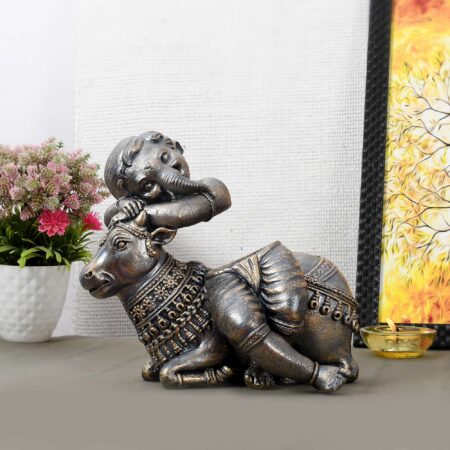 Artisan-crafted metal Ganesha figurine with Nandi, cultural Indian art piece for Diwali interiors