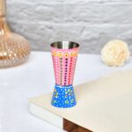 Colorful hand-painted aluminium cup featuring festive Indian folk design