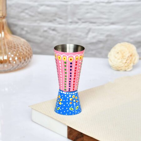 Colorful hand-painted aluminium cup featuring festive Indian folk design