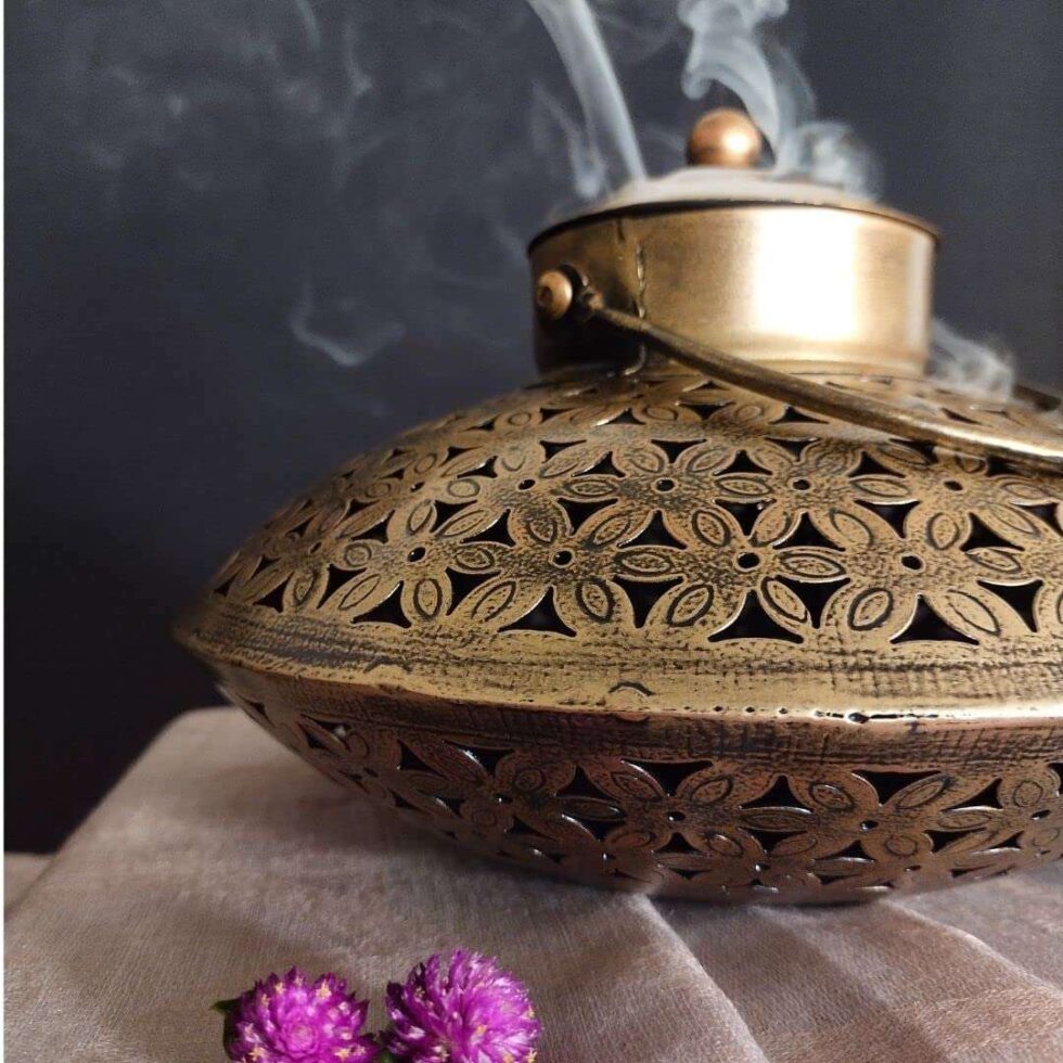 Handcrafted brass incense burner with floral cutwork design, perfect for Diwali festive home decor