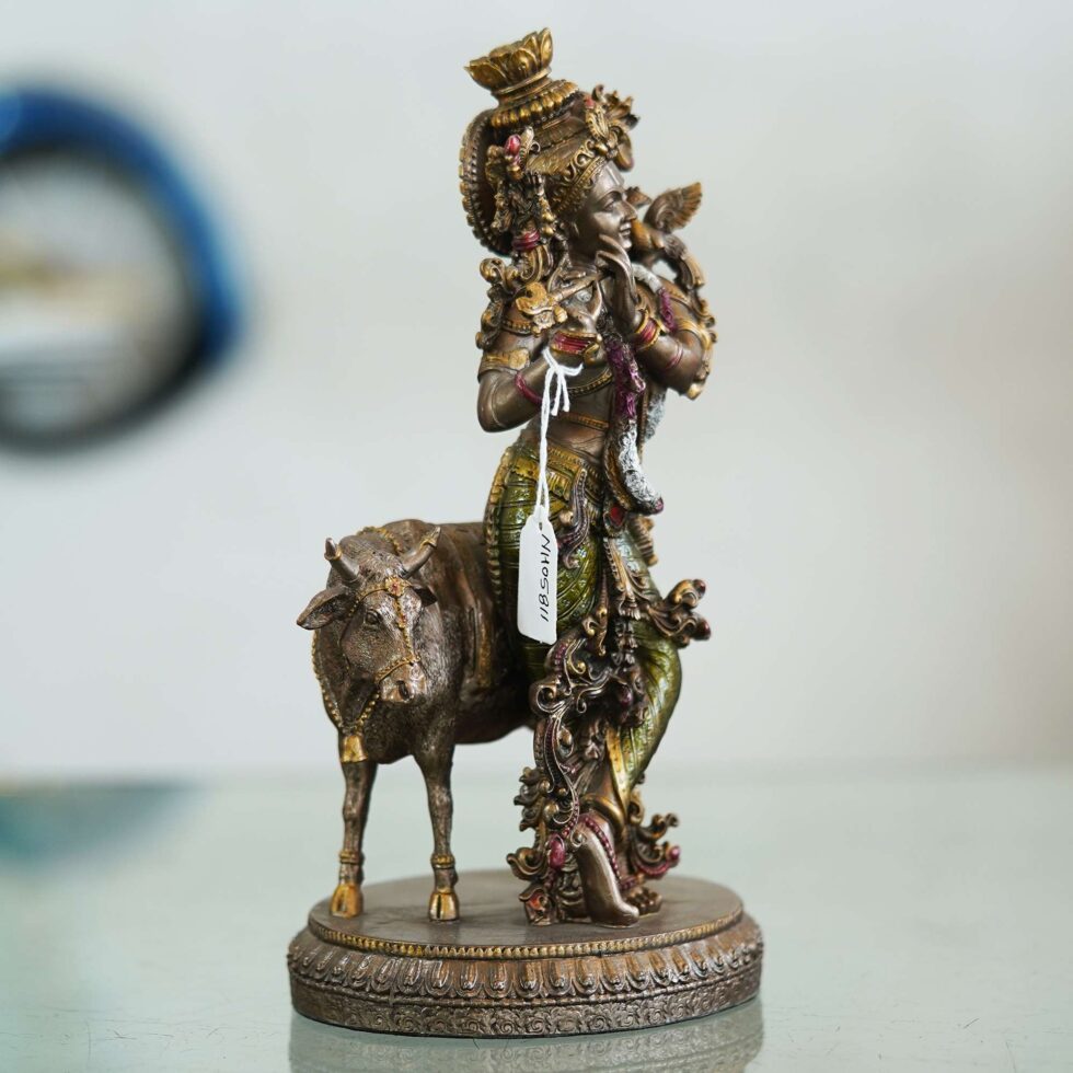 Artisan-crafted bronze Krishna and cow sculpture, elegant handmade decor for festive interiors
