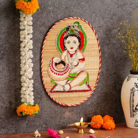 Artisan-crafted bamboo wall decor with child Krishna design, cultural Indian art for Diwali interiors