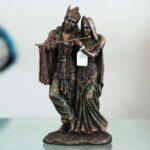 Vintage bronze Radha Krishna murti with intricate detailing, auspicious decor for Diwali celebrations