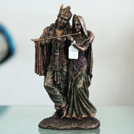 Vintage bronze Radha Krishna murti with intricate detailing, auspicious decor for Diwali celebrations