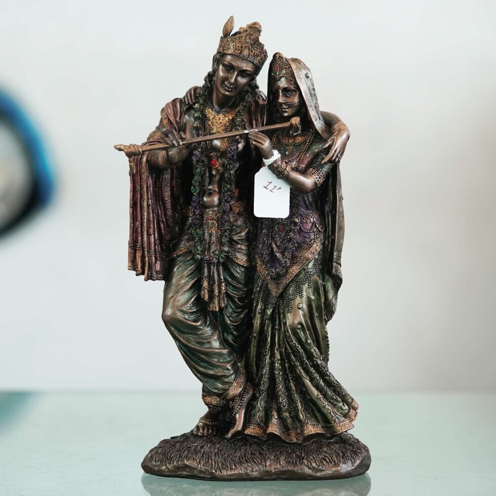 Vintage bronze Radha Krishna murti with intricate detailing, auspicious decor for Diwali celebrations