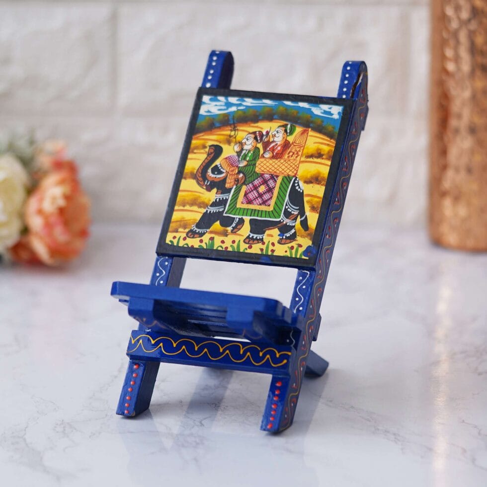 Hand-painted wooden mobile stand featuring traditional Rajasthani artwork, showcasing a royal elephant motif — a perfect blend of function and ethnic art for your desk or home décor.
