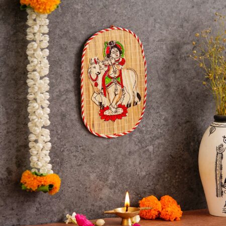 Artisan-crafted bamboo wall decor depicting Krishna playing flute, cultural Indian art for Diwali interiors