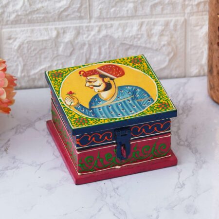 Decorative wooden gift boxes with colorful detailing and ethnic charm.