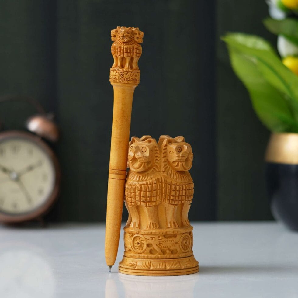 Handcrafted wooden Ashoka Pillar figurine — elegant Indian handicraft for home and office display.