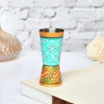 Artisan-crafted aluminium glass with floral turquoise and orange pattern, handmade decor piece